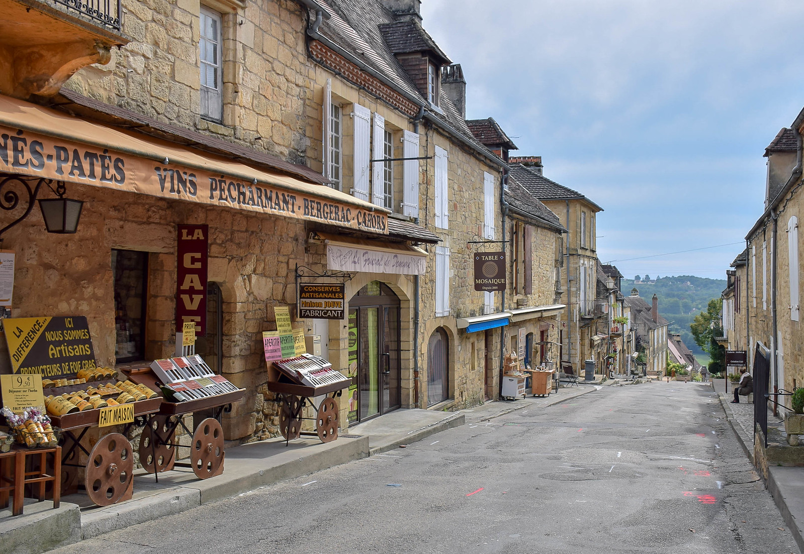 Medieval street and shops in Domme. Stunning views make it one of the prettiest villages in the Dordogne, France.