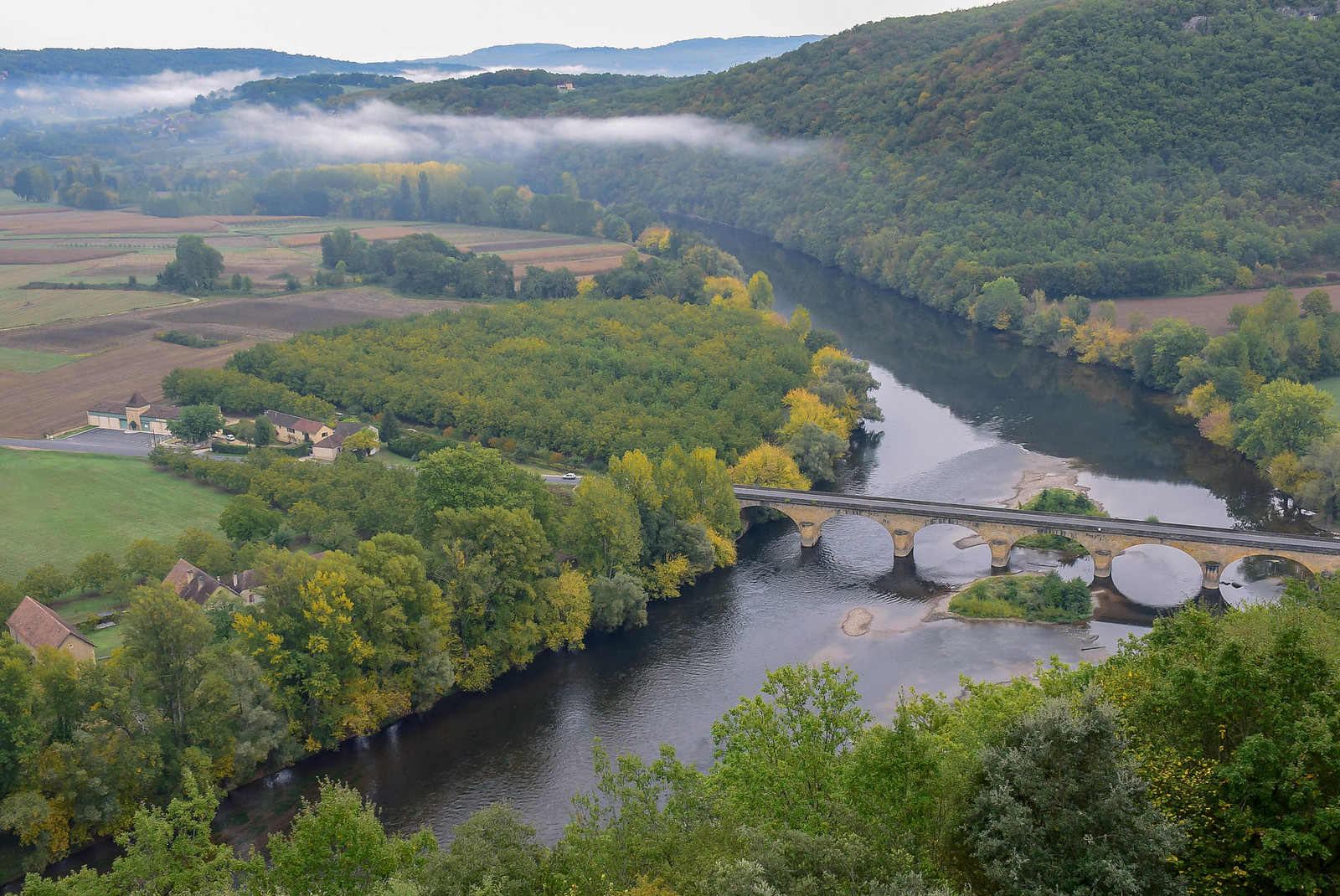 View of a bridge and the Dordogne River from Castelnaud, France