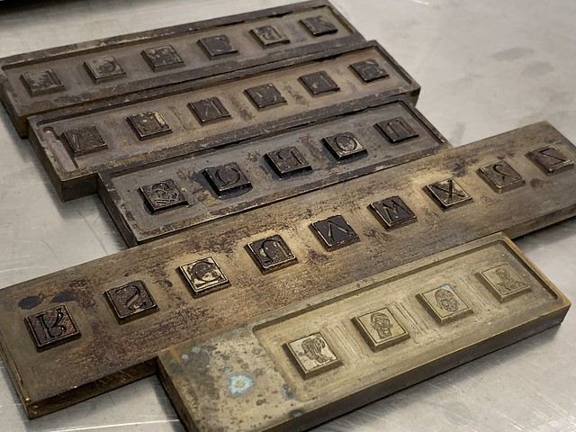 Initials cut into brass to electrotype a font of 30 initials