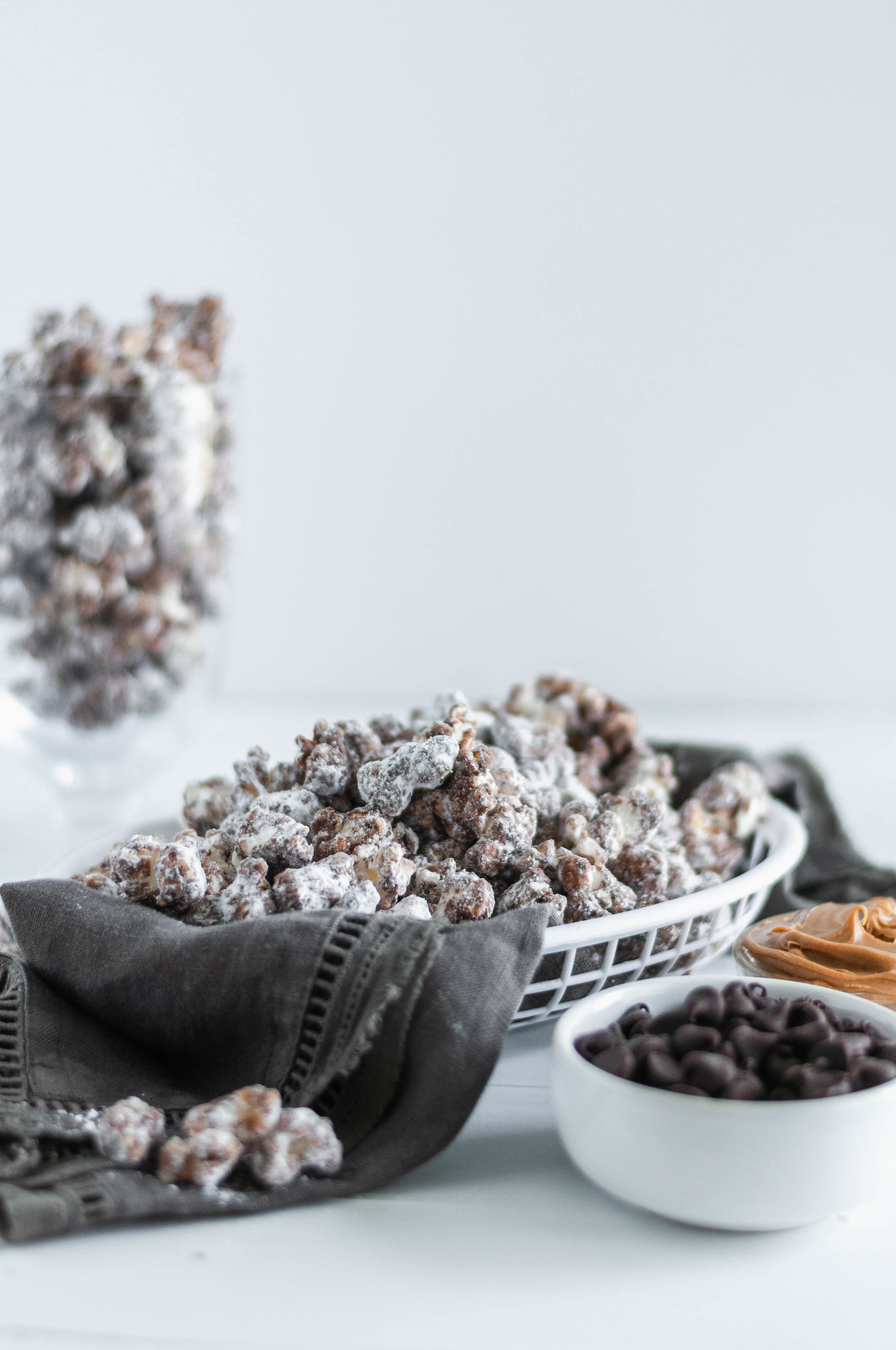 Update your game day snacking with this Puppy Chow Popcorn. Peanut butter and chocolate coated popcorn tossed in powdered sugar. Addiction ahead.