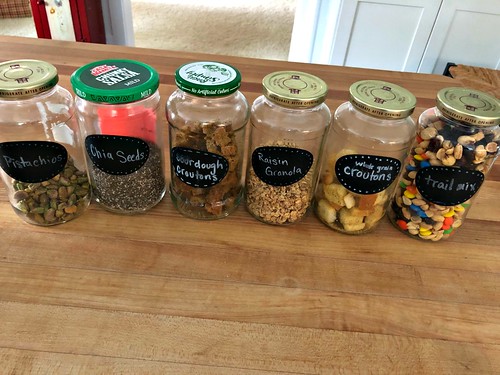 recycled food jars turned storage jars with glass knob tops