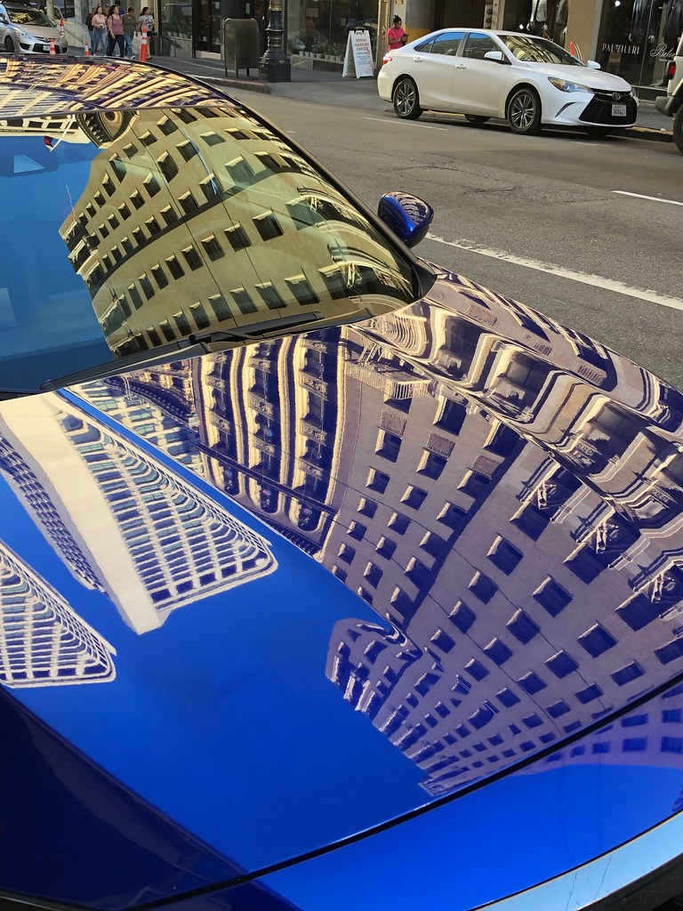 Reflections on a blue car