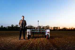 Male mechanical engineer with agricultural robot | by This is Engineering image library