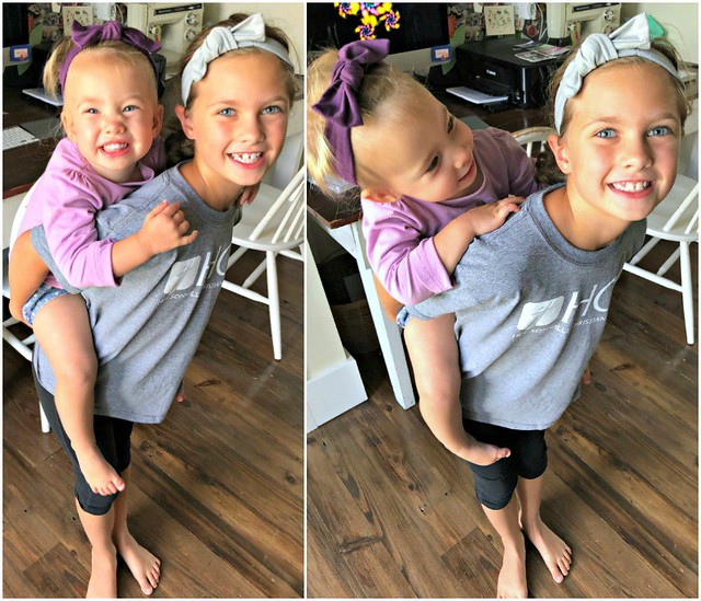 sweet sisters with matching hair bows