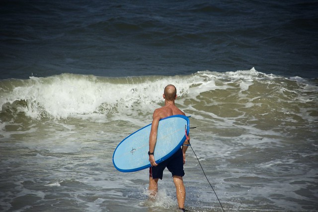 Man with Blue Surfboard