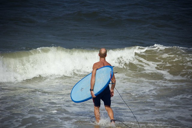 Man with Blue Surfboard