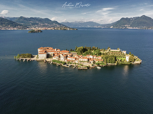 andreamoscato italia landscape light luce paesaggio sky shadow cielo clouds nature natura nuvole natural naturale view vista vivid day panorama lago lake water freshwater ombre yellow mountain island isola city città boat piemonte orange house architecture architettura art overlook fly drone dji mavic air quadcopter blue dark deep garden montagna monte roof waves riflesso reflection park pier pontile sun