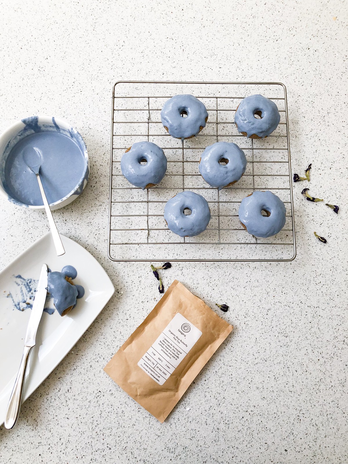 making blue glazed donuts