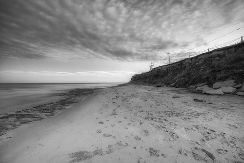 bw blackwhite shawnharquail beach blackandwhite cloud clouds footsteps landscape monochrome ocean outdoor pole sand shawnharquailcom sky storm water