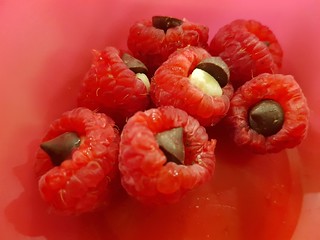 Raspberries stuffed with mini marshmallows and chocolate chips