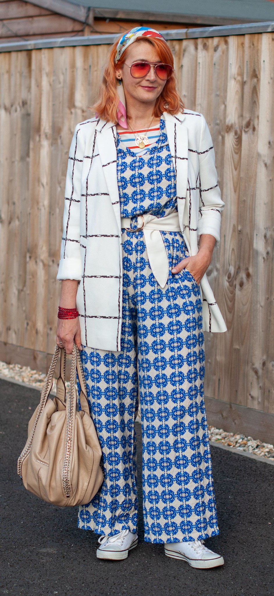 Styling a Summer Jumpsuit in Autumn With Serious Pattern Mixing: Blue patterned jumpsuit, black and white windowpane check jacket, white tennis shoes | Not Dressed As Lamb, over 40 fashion blogger