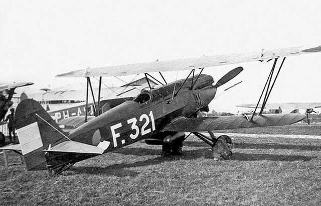 A Fokker D-XVII around feb 1932. Photo taken at some time during evaluation. This fighter was desigened for the KNIL. But the ML KNIL chose a other fighter, namely the Curtiss P-6E Hawk. In the left corner you see a P-6E Hawk.  And a few Fokker airliners