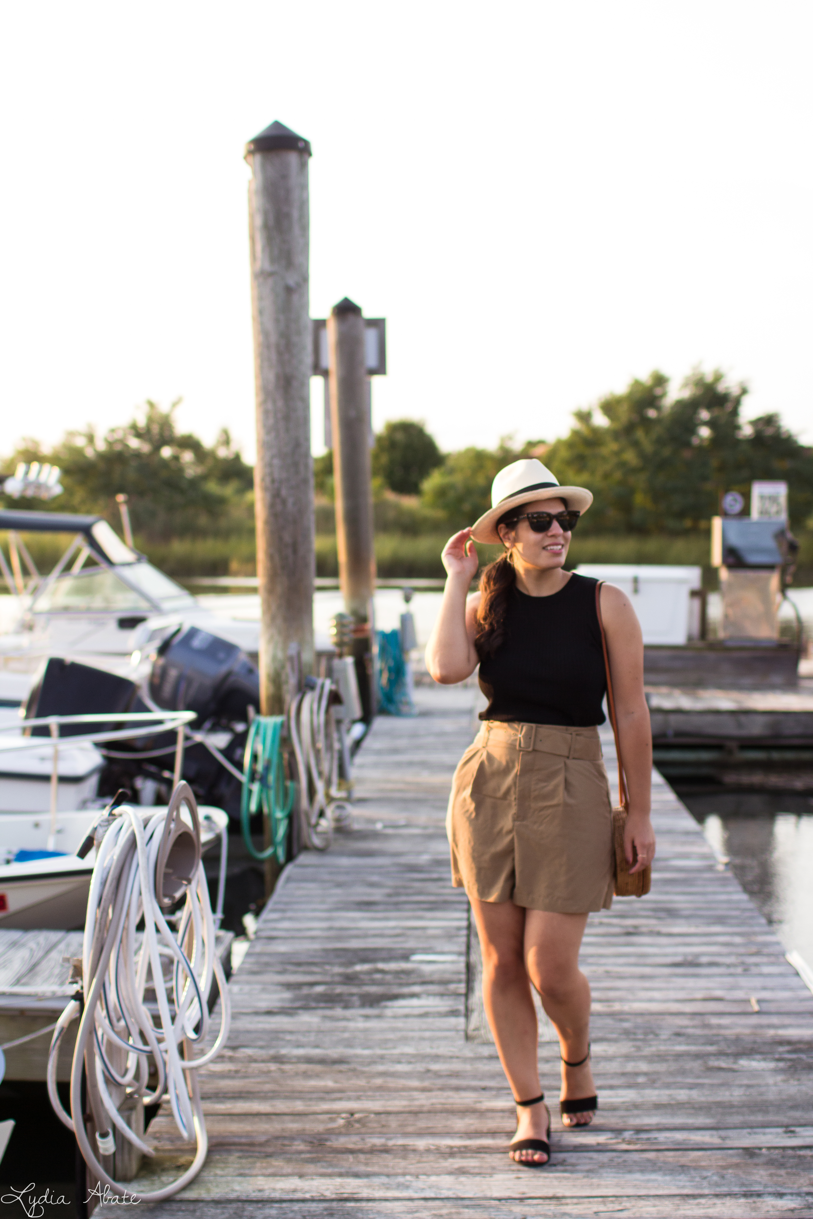 paperbag waist shorts, black knit top, round rattan bag, panama hat-5.jpg