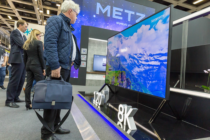 IFA visitors looking at the Sharp 8K TV, with a huge 120" screen