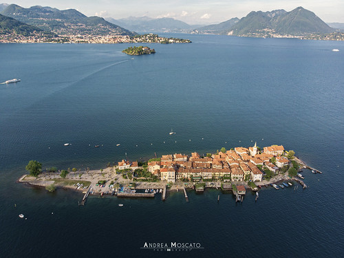 andreamoscato italia landscape light luce paesaggio sky shadow cielo clouds nature natura nuvole natural naturale view vista vivid day panorama lago lake water freshwater ombre yellow mountain island isola city città boat piemonte orange house architecture architettura art overlook fly drone dji mavic air quadcopter blue dark deep montagna monte roof waves pier pontile sun