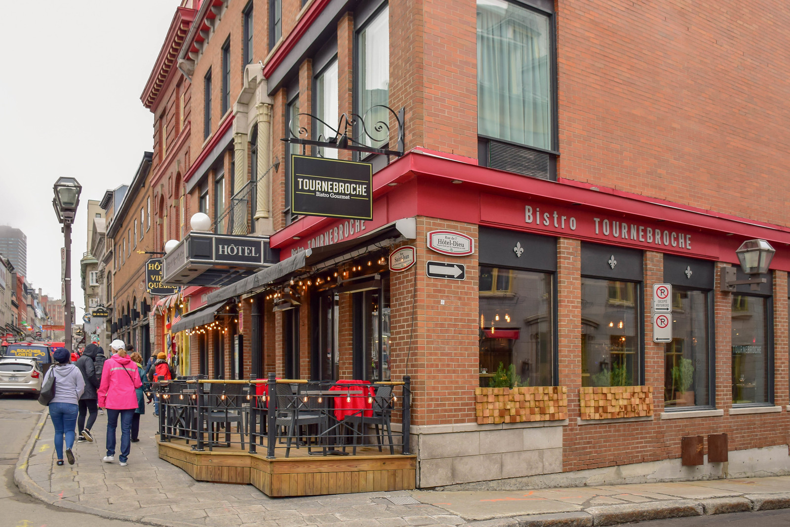 Bistro Tournebroche and hotel on a street corner in St. Jean, in Quebec City, Canada