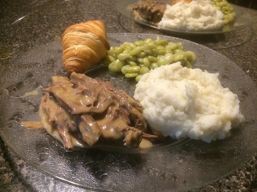 food dinner dish roast beef mashed potatoes butter peas roll