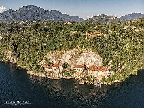 andreamoscato italia montagna landscape light luce paesaggio sky shadow nature natura natural naturale view vista vivid day panorama lago lake water freshwater ombre yellow mountain boat orange house architecture architettura art overlook fly drone dji mavic air quadcopter blue dark deep buildings monte pier monument roof monastero green trees rock cliff white yacht cielo