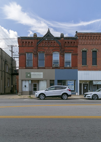 westernunion building structure historic commercial 1888 twostory brick romanesque carvings terracotta ornate floral roundarched arcaded storefronts altered remodeled sidewalk street clouds vanwert ohio vanwertcounty van2597 11windows segmentalarched corbelling corbelled