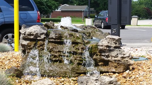 springfieldmo springfieldmissouri fountain water flowing landscaping greenecounty mcdonalds yellowpole pole gravel rock