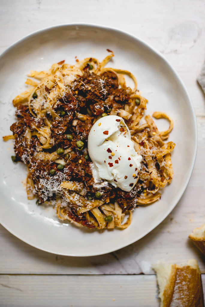 Weeknight dinner with a bit of a kick! Chorizo bolognese with briny capers and finished with creamy burrata cheese.
