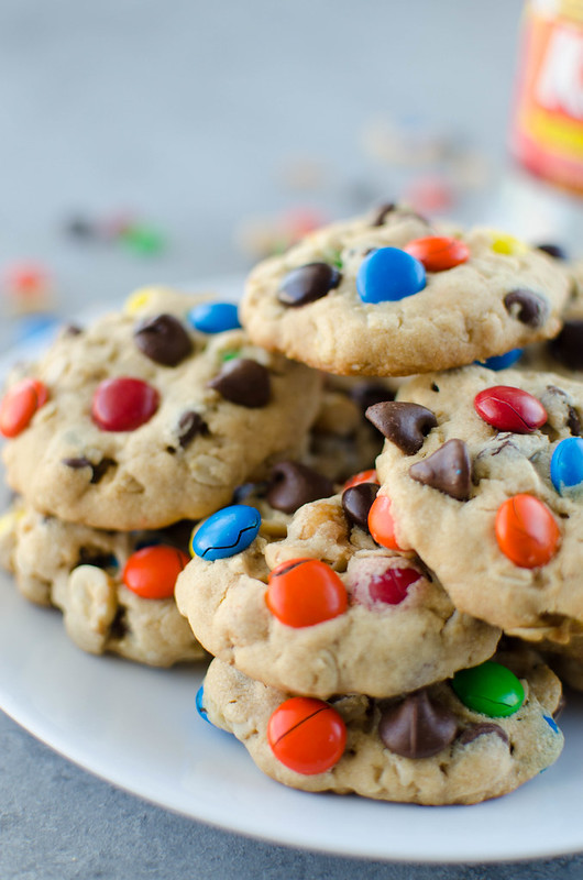 Chewy Monster Cookies - soft and chewy peanut butter cookies filled with oats, chocolate chips, peanuts, raisins, and M&Ms! 
