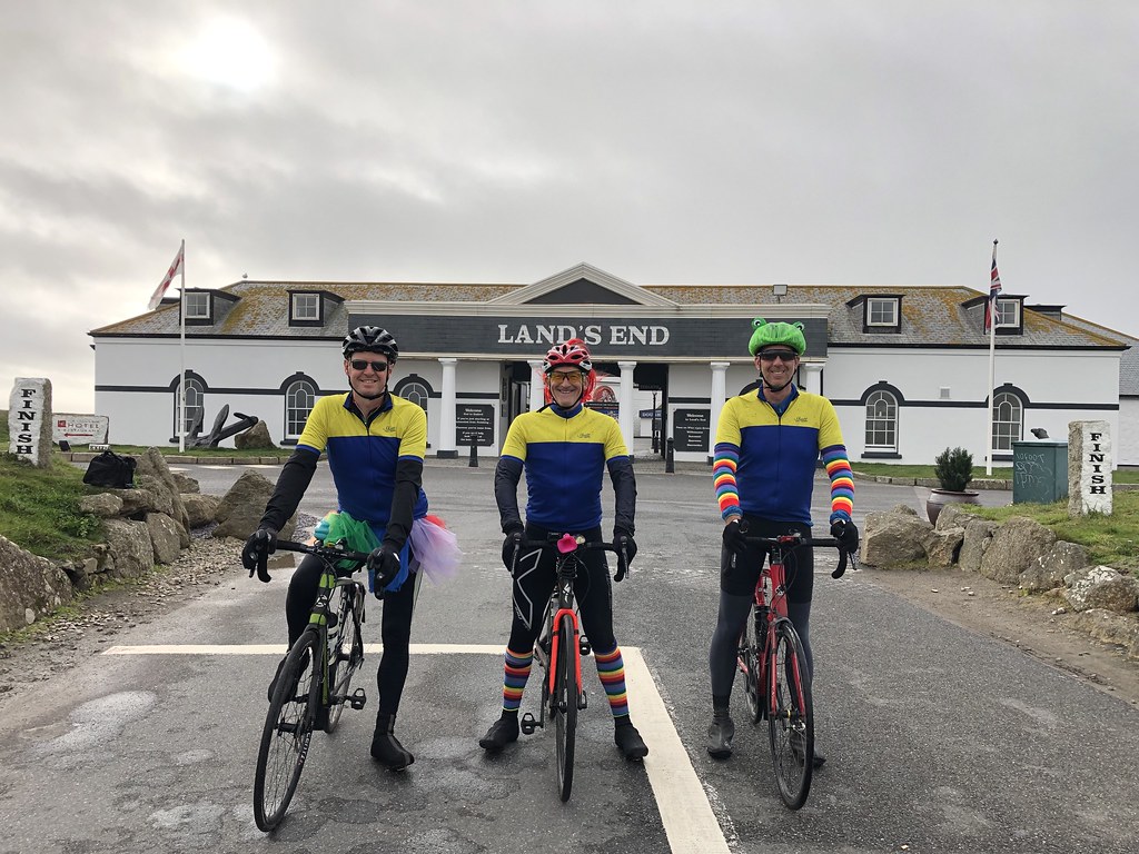 Darren, Mike and Me at Land's End. The rainbow colours and frog shower cap were for comic effect.