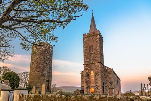 19thcentury anglican church churchofireland countyantrim darkages ireland medieval northernireland roundtower sky sunset ulster 北爱尔兰 爱尔兰
