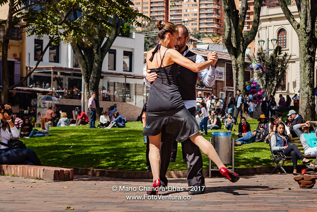 Bogotá, Colombia - The Mercado de Las Pulgas in the popular Usaquén District. A Couple of Street Dancers do the Tango to Entertain Visitors.