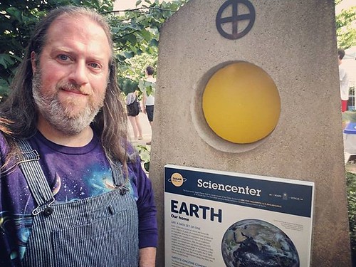 The Earth plinth on the Sagan Planet Walk, with one of Earth's progeny. #ithaca #ithacaapplefest #saganplanetwalk #overalls #dungarees #biboveralls #hickorystripe #zacedenim #brandedzace