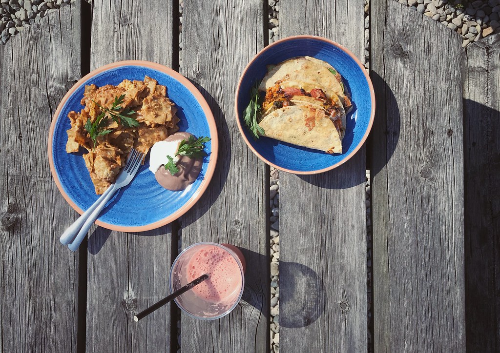 Chilaqules, agua fresca, and quesadillas from Ivanopoblano on a picnic table