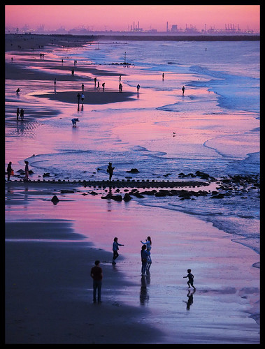 scheveningen netherlands denhaag holland zuidholland beach people sunset sundown water sea shore waves clouds evening summer leisure pattern sand snapshot holiday