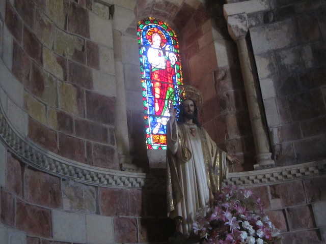 Stained glass and statue, Basilica of San Isidoro, Plaza de San Isidoro, Leon.