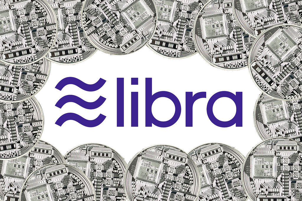 Facebook Cryptocurrency Libra on a White Background Surrounded by Altcoins