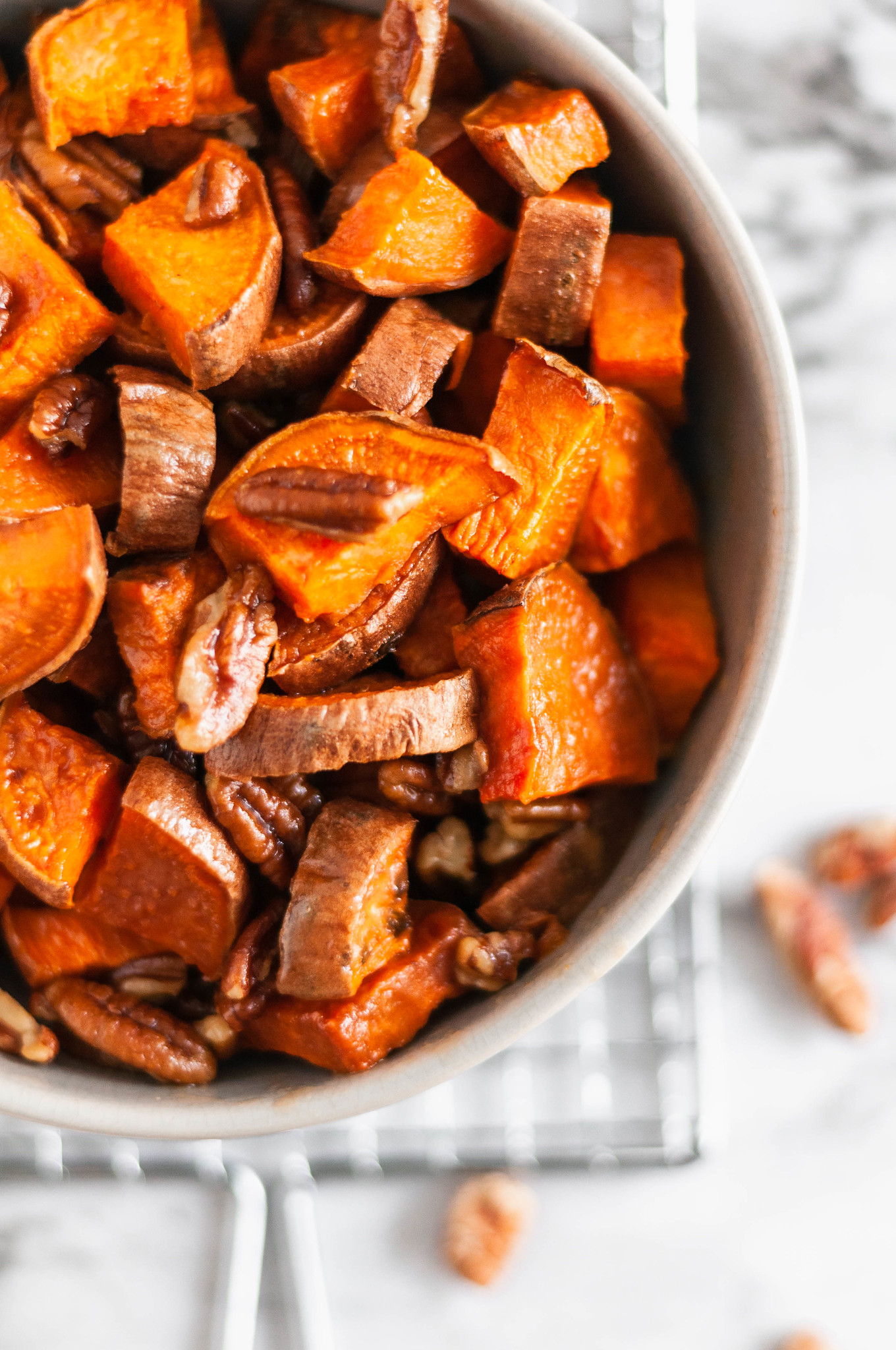 These Roasted Sweet Potatoes with buttery pecans are the perfect simple and easy side dish to add to your holiday menu. Less than 40 minutes from start to finish and you'll have sweet, tender, crunchy, buttery goodness on your dinner table.