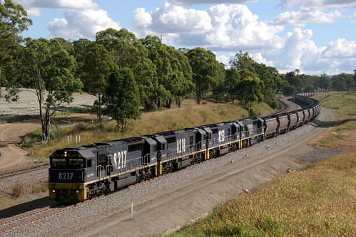 I.D.s 914 & 14451 2013-04-10 of Pacific National diesel locomotives 8217 + 8218 + 8253 + 8221 up coal Wambo to Port Kembla. The train is nearing railway station Lochinvar, in the Hunter Valley west of Newcastle, N.S.W., Australia.