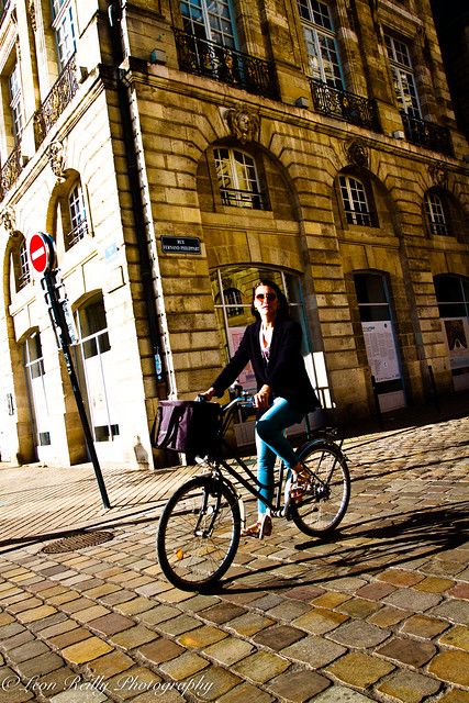 Cyclist at Place de la Bourse