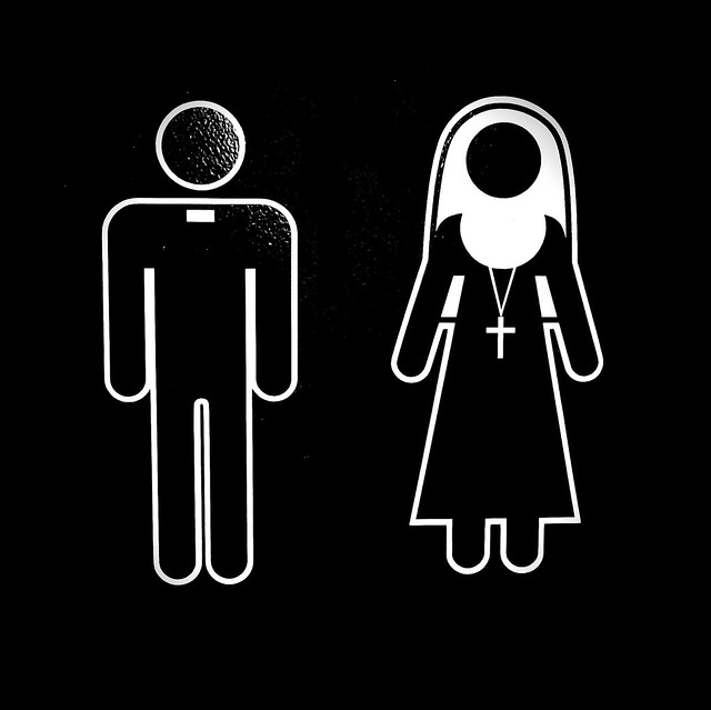 Priest / monk, nun figures on the washroom door