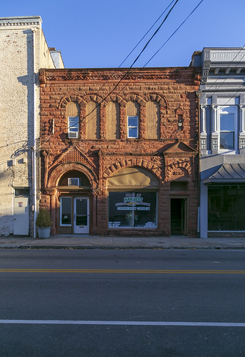 building structure historic commercial twostory 1897 romanesque rusticated stone stonework roundarched altered remodeled sidewalk street cables wires richardsonian storefront cynthiana kentucky harrisoncounty