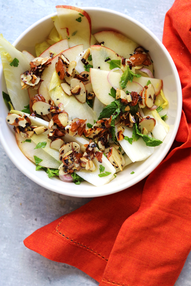 apple and endive salad with parsley, mint, and salted almonds