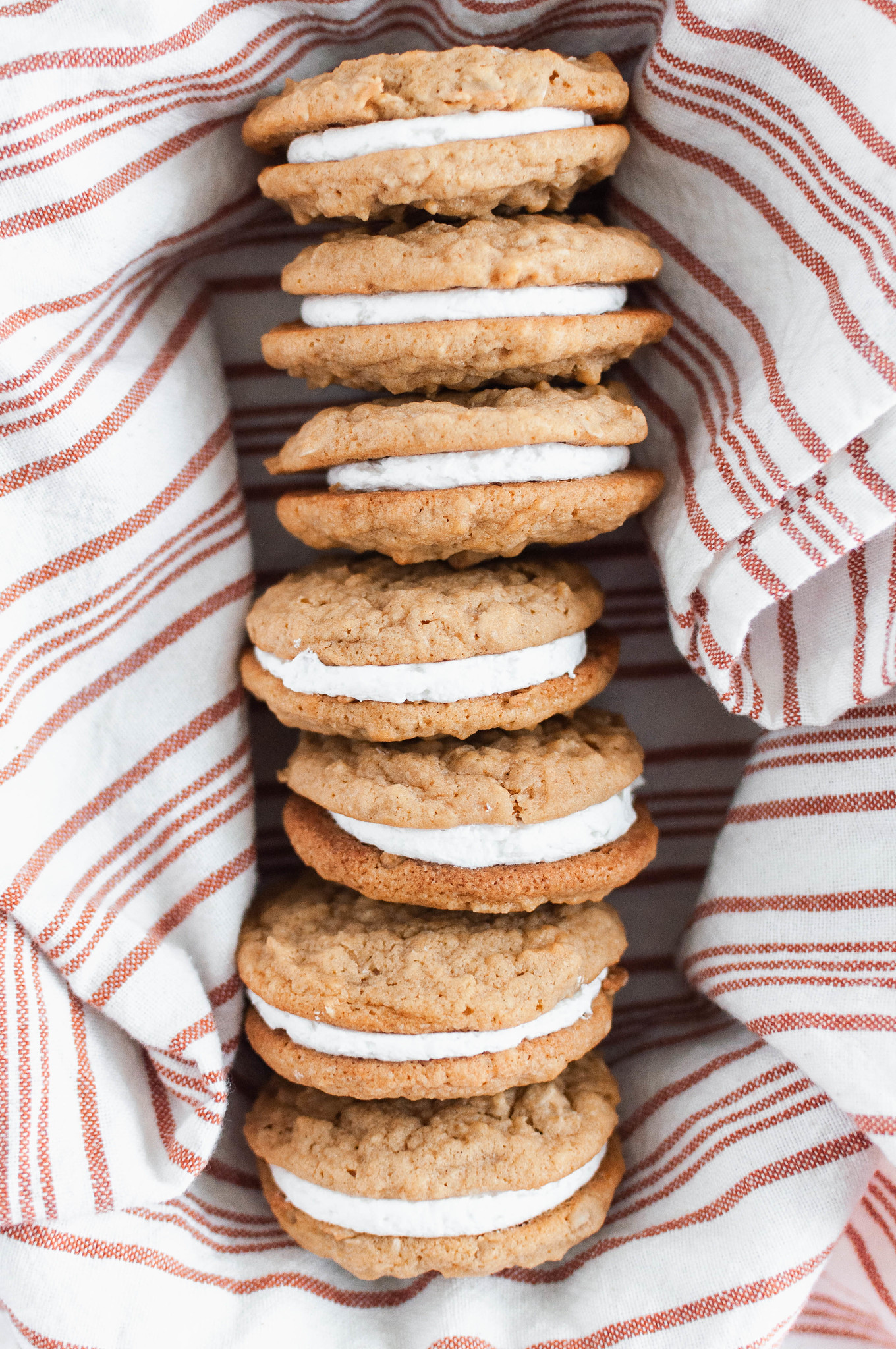 These Pumpkin Oatmeal Creme Pies will immediately become your new favorite fall dessert. Pumpkin oatmeal cookies with a fluffy marshmallow filling.