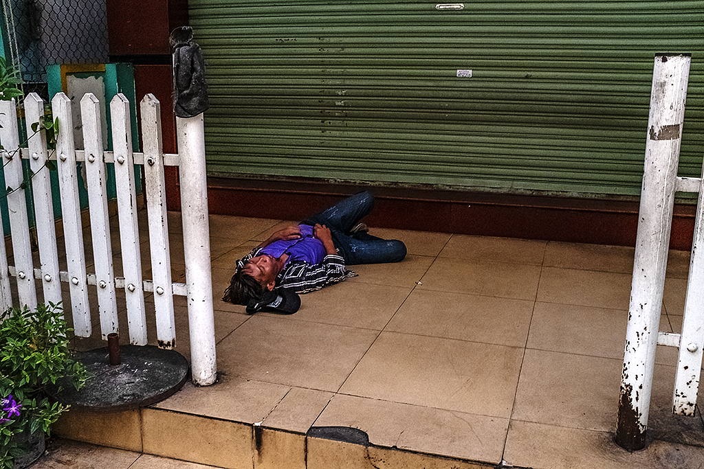 Man sleeping outside in District 6--Saigon