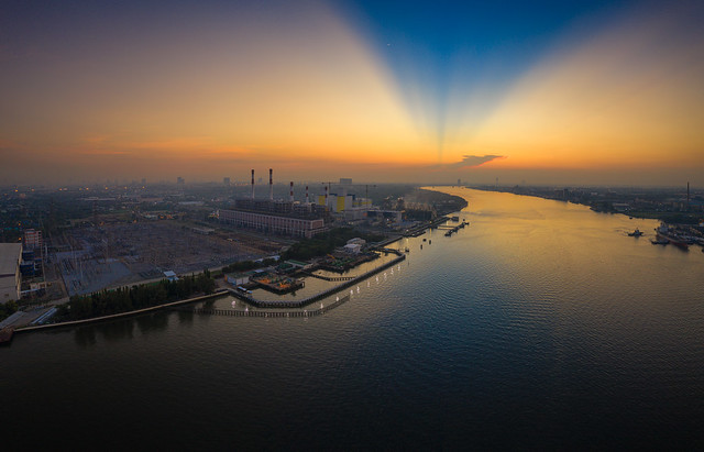 Panorama of Power plant or Electrical power generation plant near the river at sunrise