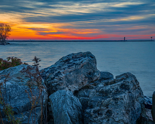 sunrise sunset dawn colors water lakemichigan rocks nature landscape waterscape lighthouse outdoor