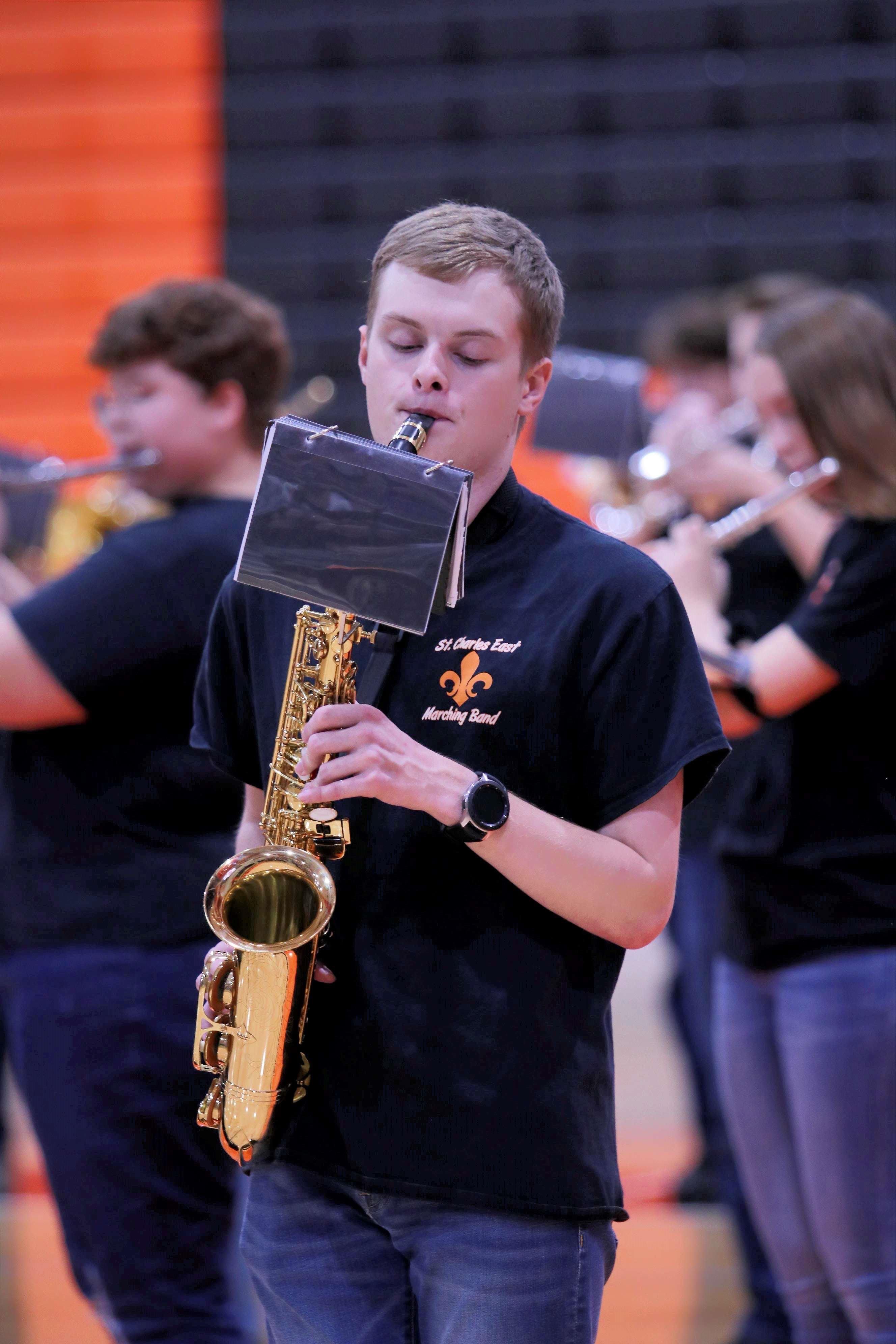 A picture of me playing Saxophone with my high school's marching band.