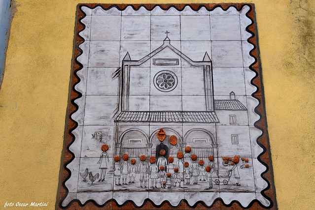 Sant'Angelo il paese delle fiabe, in questo quadro si vuol raffigurare la sua piccola comunità all'uscita della chiesa nei momenti di festa,