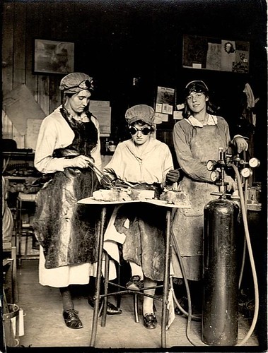 Unidentified women at work with oxyacetylene in a workshop