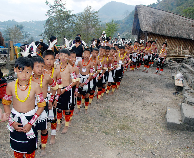 Teach them young! Boys of the Angami tribe getting ready for a tribal dance, Nagaland, India.
