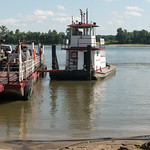 Cave-In-Rock Ferry, IL (#0517) The ferry barge and its tug are separate units, with the tug connected to the barge by just a heavy rod.  The tug has some power to run in reverse, but once far enough away from land, it swings around for crossing the river.