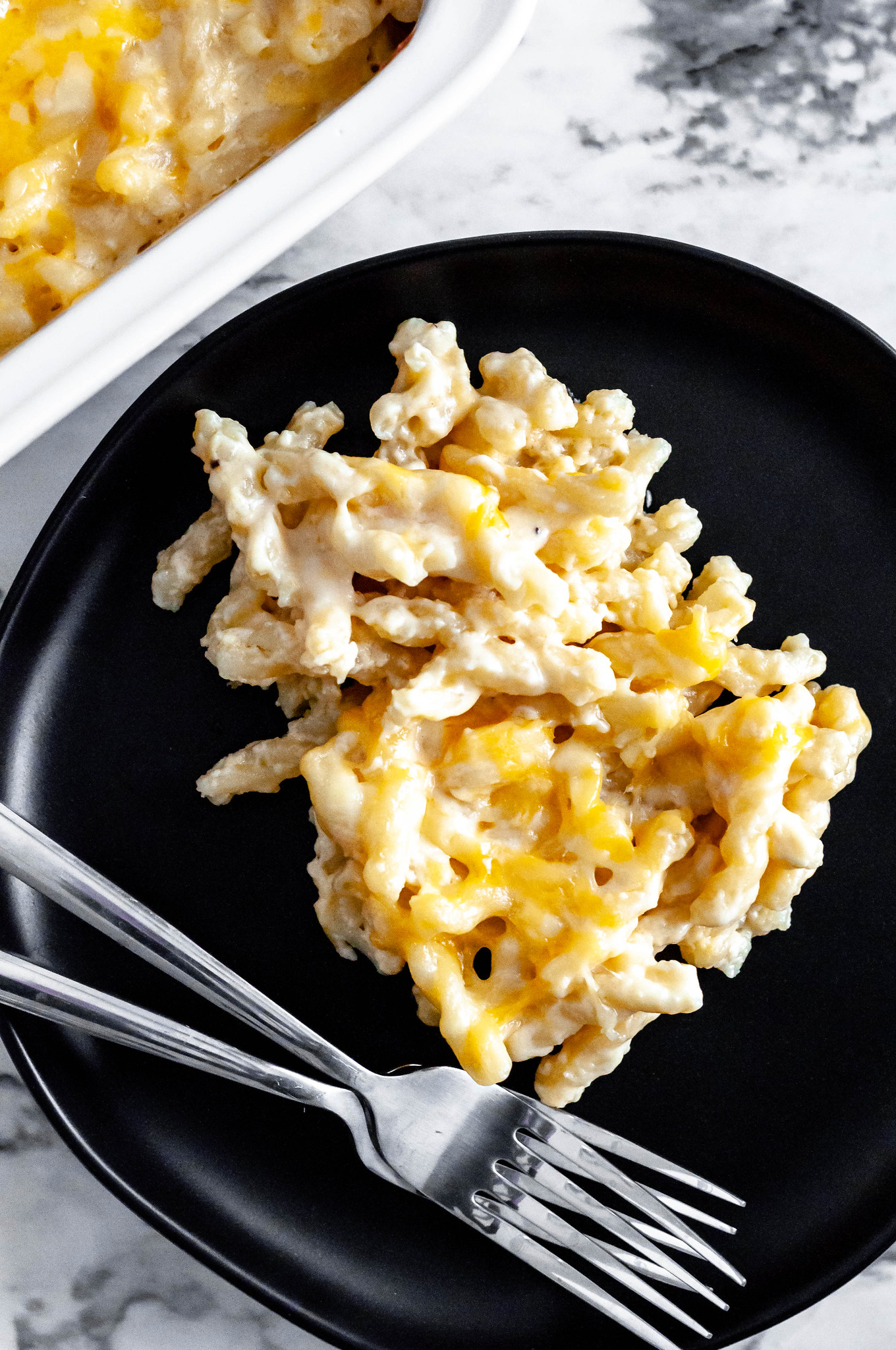 This creamy Smoked Gouda and Sharp Cheddar Macaroni and Cheese is the ultimate pasta dish. Just what your holiday table needs.